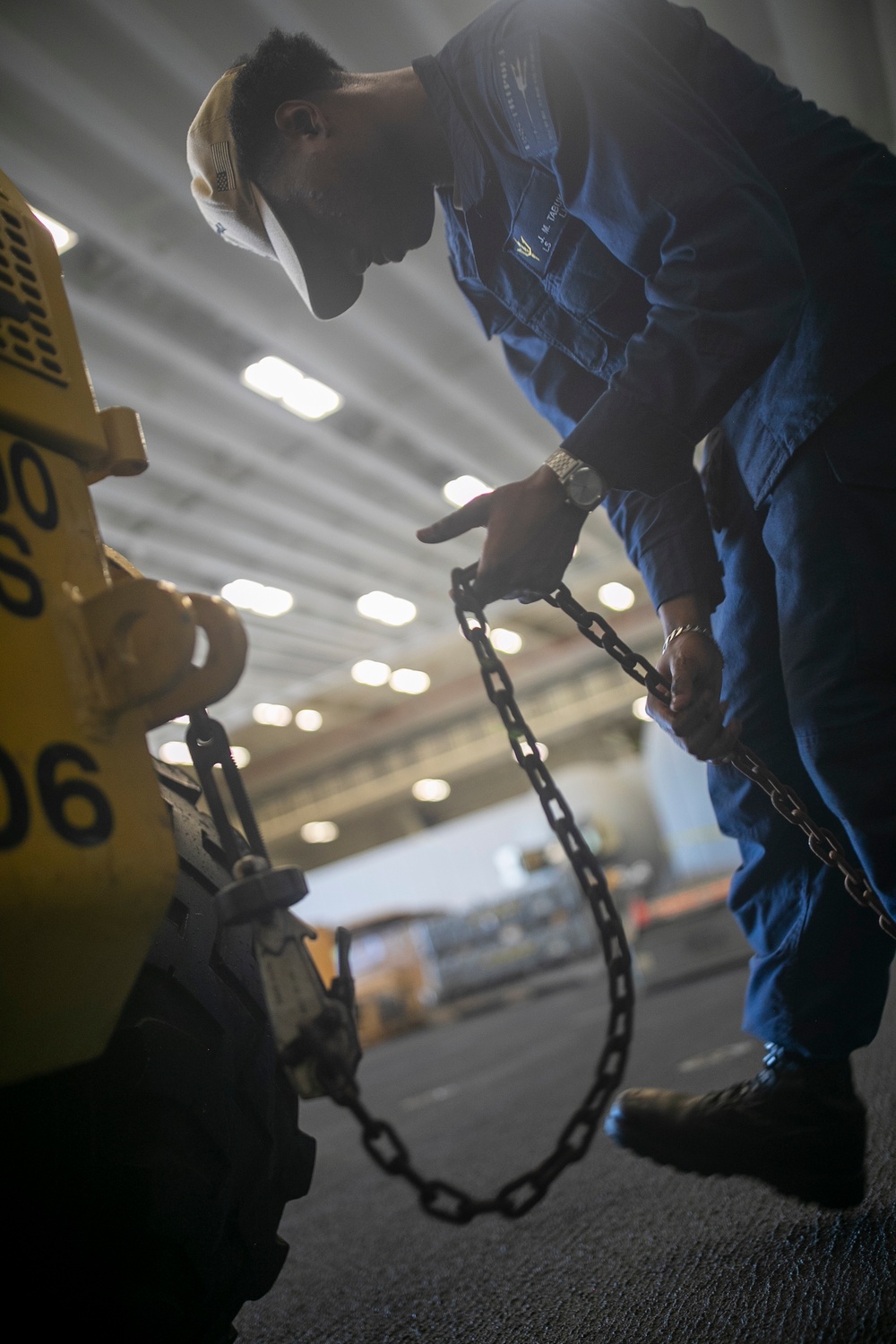 USS Tripoli Sailors Preform Maintenance