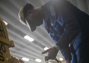 USS Tripoli Sailors Preform Maintenance
