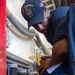 USS Tripoli Sailors Preform Maintenance