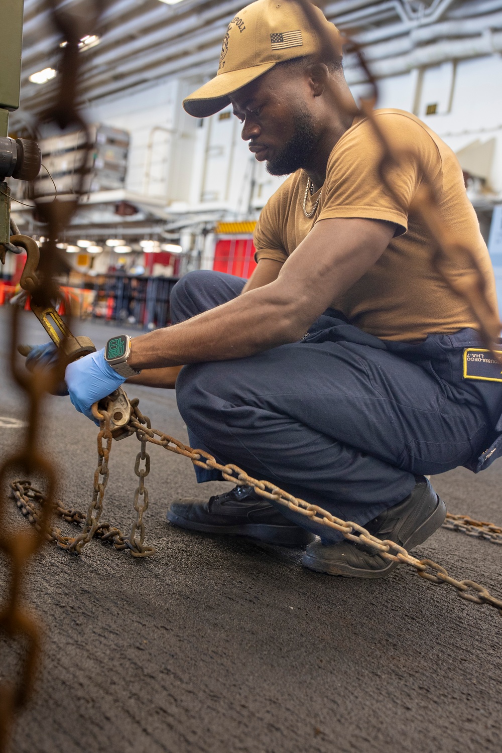USS Tripoli Sailors Preform Maintenance