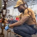USS Tripoli Sailors Preform Maintenance