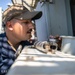 USS Mitscher (DDG 57) Sailor checks locker temperatures