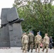 Polish and U.S. Soldiers march to lay wreath