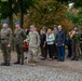 Soldiers and officials line up to lay wreaths
