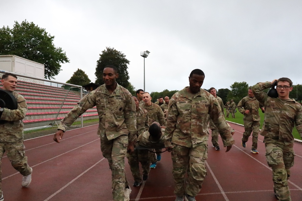 16th Sustainment Brigade soldiers display grit long side 21st TSC CG during combat-inspired PT competition