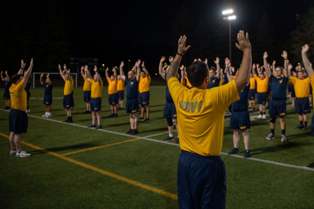 Sailors selected for chief petty officer PT with Rear Adm. Nash