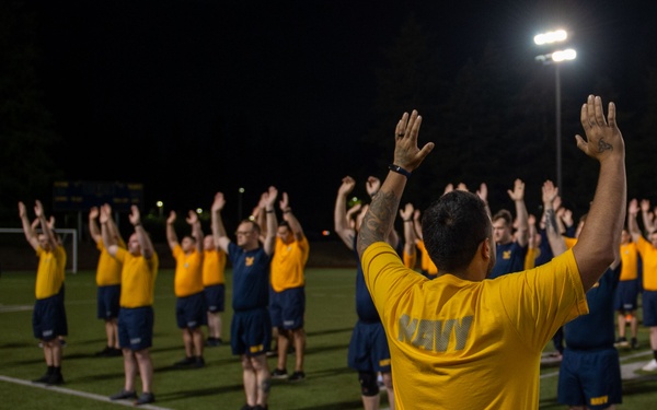 Sailors selected for chief petty officer PT with Rear Adm. Nash