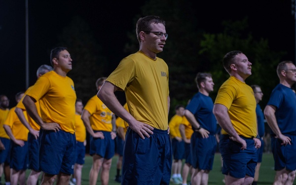 Sailors selected for chief petty officer PT with Rear Adm. Nash