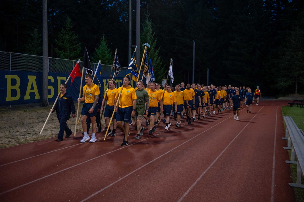 Sailors selected for chief petty officer PT with Rear Adm. Nash