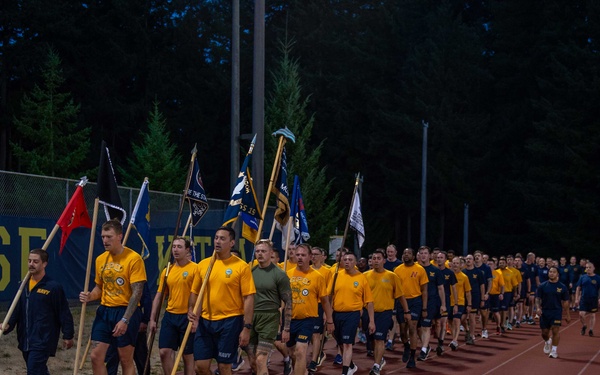 Sailors selected for chief petty officer PT with Rear Adm. Nash