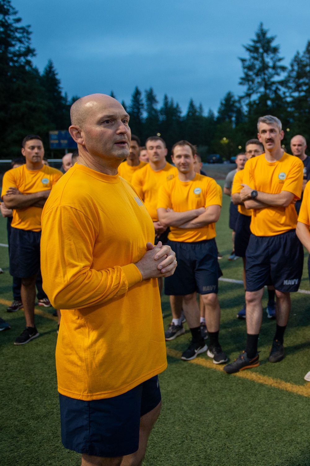 Sailors selected for chief petty officer PT with Rear Adm. Nash