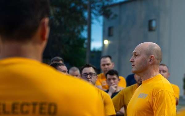Sailors selected for chief petty officer PT with Rear Adm. Nash