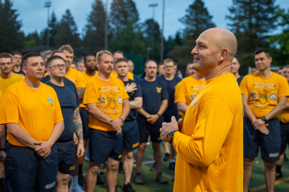 Sailors selected for chief petty officer PT with Rear Adm. Nash