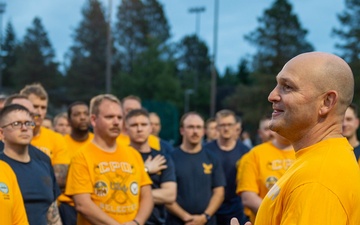 Sailors selected for chief petty officer PT with Rear Adm. Nash