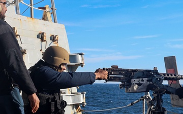 YN3 Alexander Quintero fires a .50-caliber machine gun during the Northern Coasts 2025