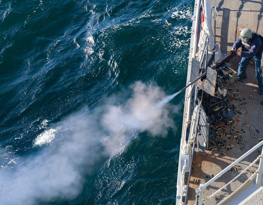 YN3 Alexander Quintero fires a .50-caliber machine gun during the Northern Coasts 2025