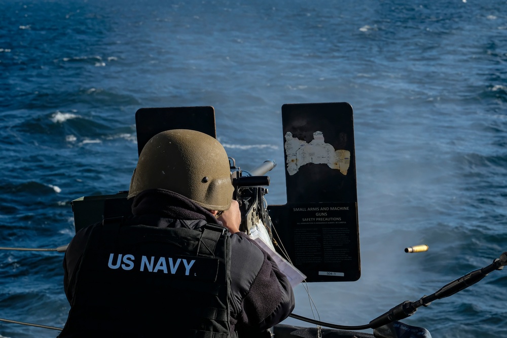 YN3 Alexander Quintero fires a .50-caliber machine gun during the Northern Coasts 2025