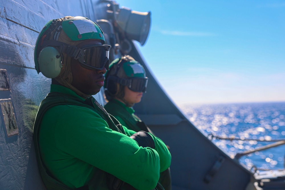 AMAN Jeremiah Cobb and AM3 Emily Downs observe MH-60R Seahawk flight observations during the Northern Coasts 2025