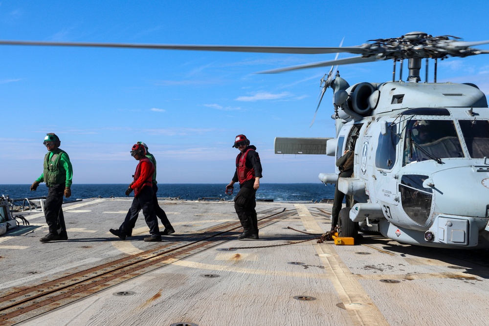 Sailors complete an MH-60R Seahawk pre-flight safety check during the Northern Coasts 2025