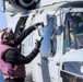 GSM2 Mark Bacca presents a fuel sample to pilot Lt. Michael Cross during the Northern Coasts 2025