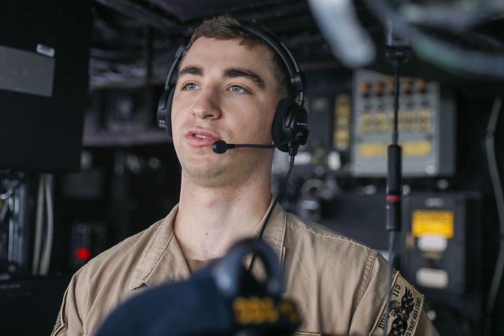 Sailors aboard the USS John Finn conduct a sea and anchor detail in Changi, Singapore