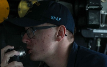 Sailors aboard the USS John Finn conduct a sea and anchor detail in Changi, Singapore