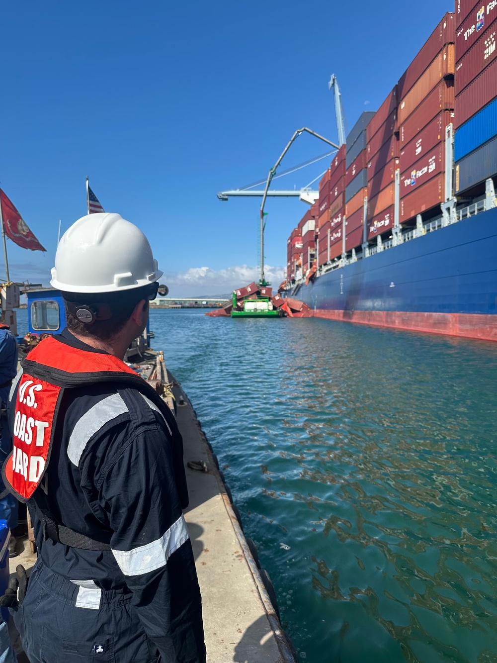 U.S Coast Guard Salvage Engineering Response Team surveys the container ship in the Port of Long Beach