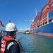 U.S Coast Guard Salvage Engineering Response Team surveys the container ship in the Port of Long Beach