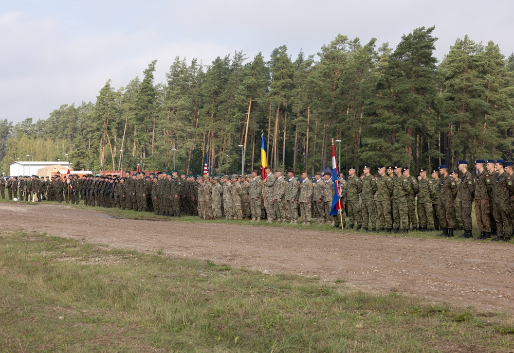 U.S. Soldiers stand in formation with NATO allies during BPTA Day