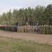 U.S. Soldiers stand in formation with NATO allies during BPTA Day