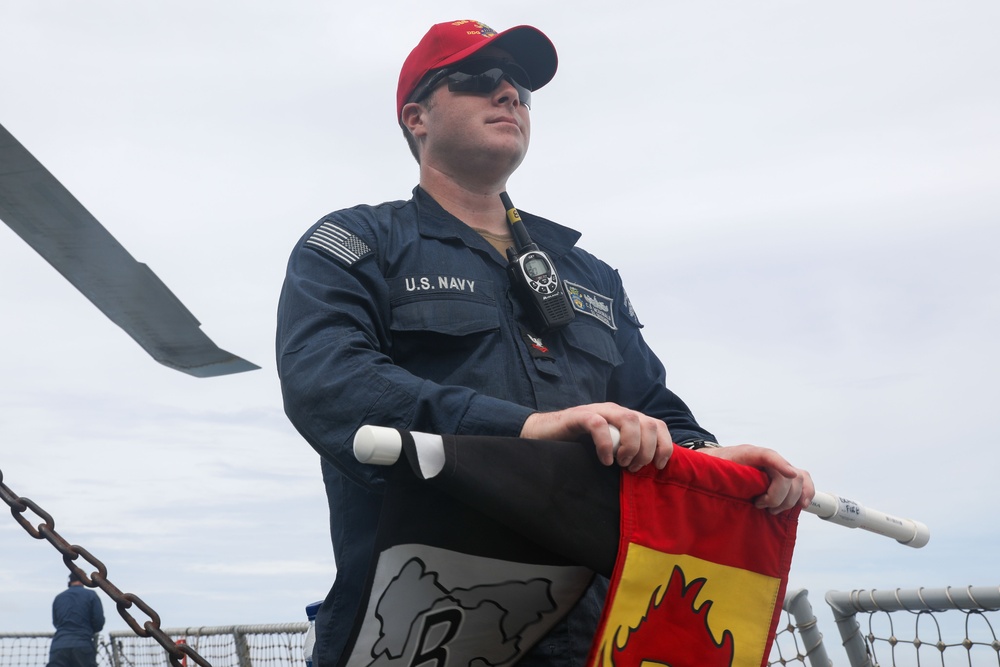 Sailors aboard the USS John Finn conduct flight quarters in the South China Sea
