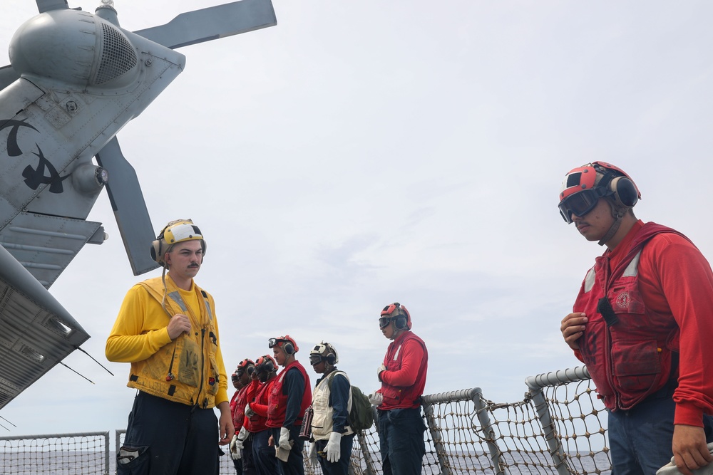 Sailors aboard the USS John Finn conduct flight quarters in the South China Sea