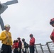 Sailors aboard the USS John Finn conduct flight quarters in the South China Sea