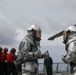 Sailors aboard the USS John Finn conduct flight quarters in the South China Sea