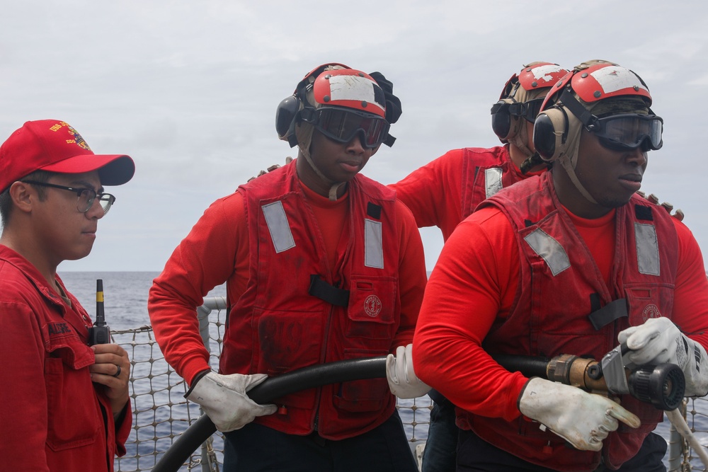 Sailors aboard the USS John Finn conduct flight quarters in the South China Sea
