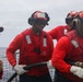 Sailors aboard the USS John Finn conduct flight quarters in the South China Sea