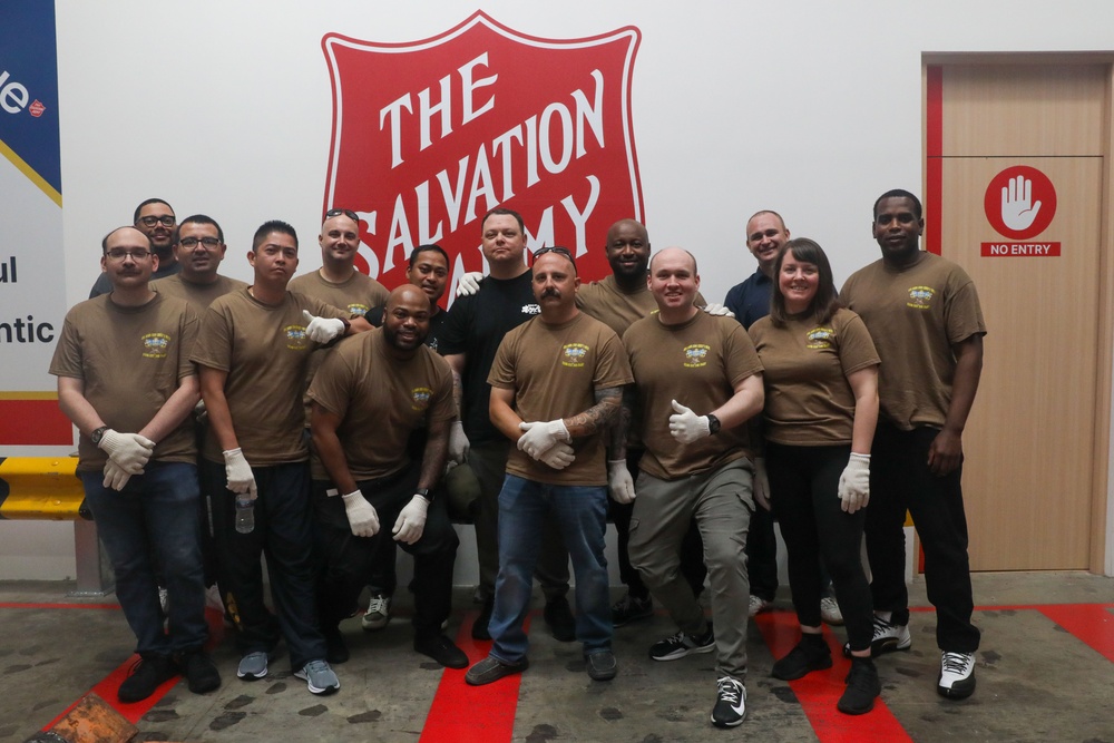 Sailors attached to the USS John Finn volunteer at the Salvation Army in Singapore