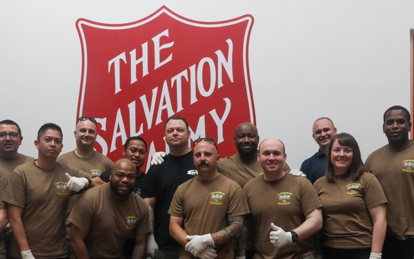 Sailors attached to the USS John Finn volunteer at the Salvation Army in Singapore