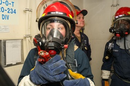 Sailors aboard the USS John Finn conduct a general quarters drill in the South China Sea