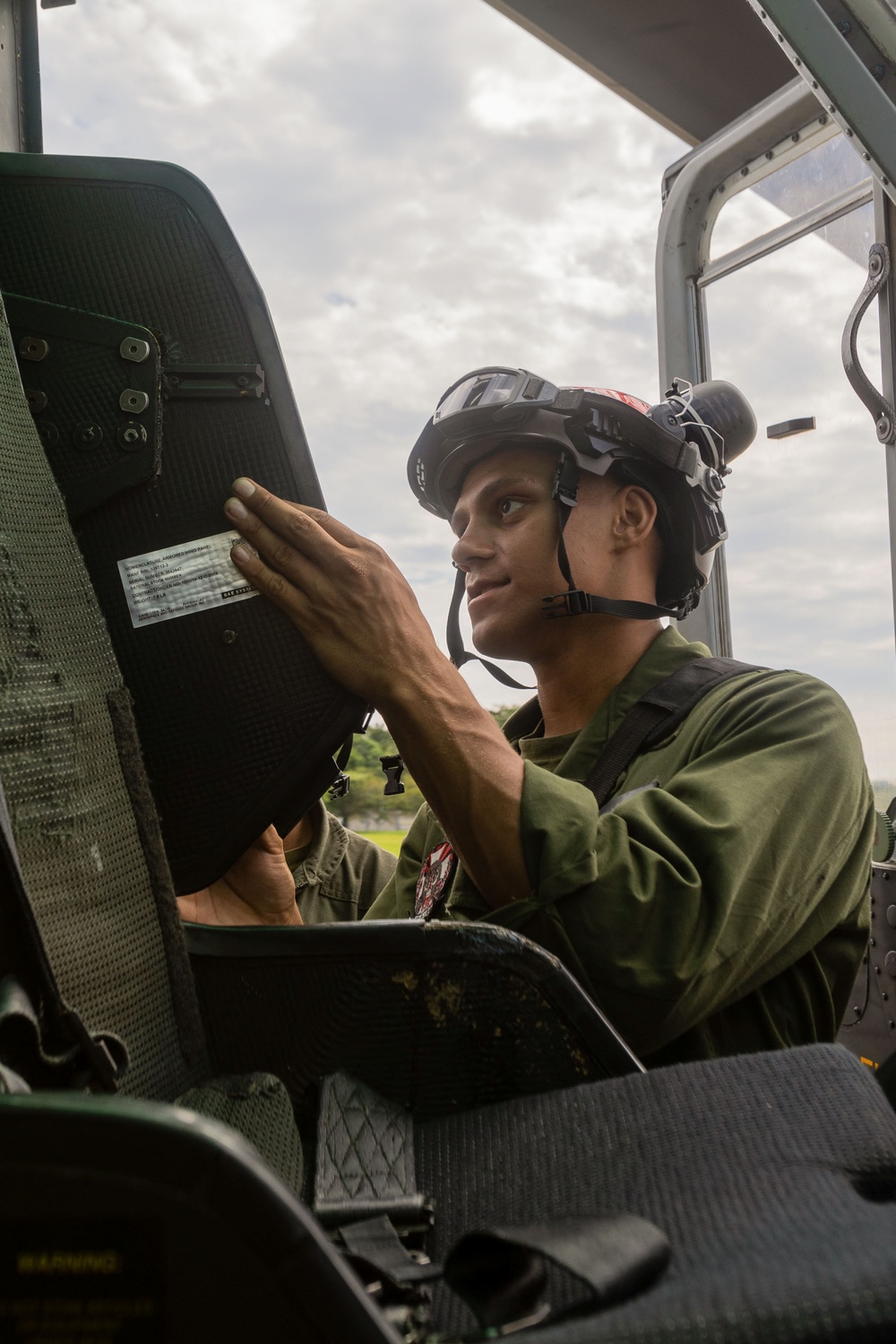 U.S. Marines with 1st Marine Aircraft Wing maintain helicopters