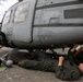 U.S. Marines with 1st Marine Aircraft Wing maintain helicopters