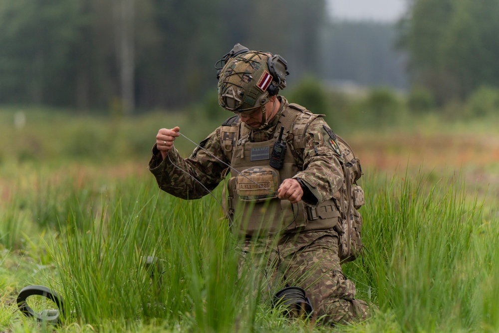 Latvian Explosive Ordnance Team Clears Trenches During Engineer Thunder 2025