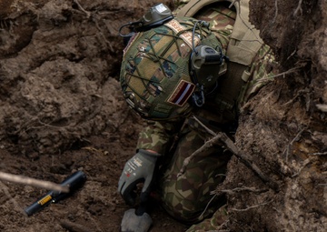 Latvian Explosive Ordnance Team Clears Trenches During Engineer Thunder 2025