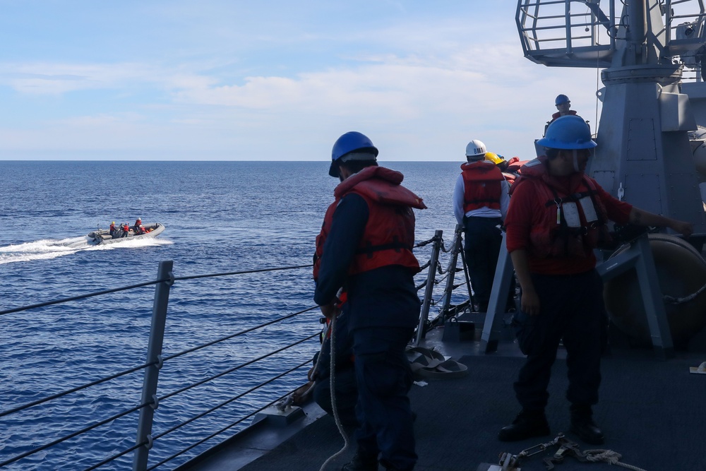 Sailors aboard the USS John Finn conduct a small boat operation during Maritime Cooperative Act in the South China Sea