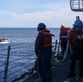 Sailors aboard the USS John Finn conduct a small boat operation during Maritime Cooperative Act in the South China Sea