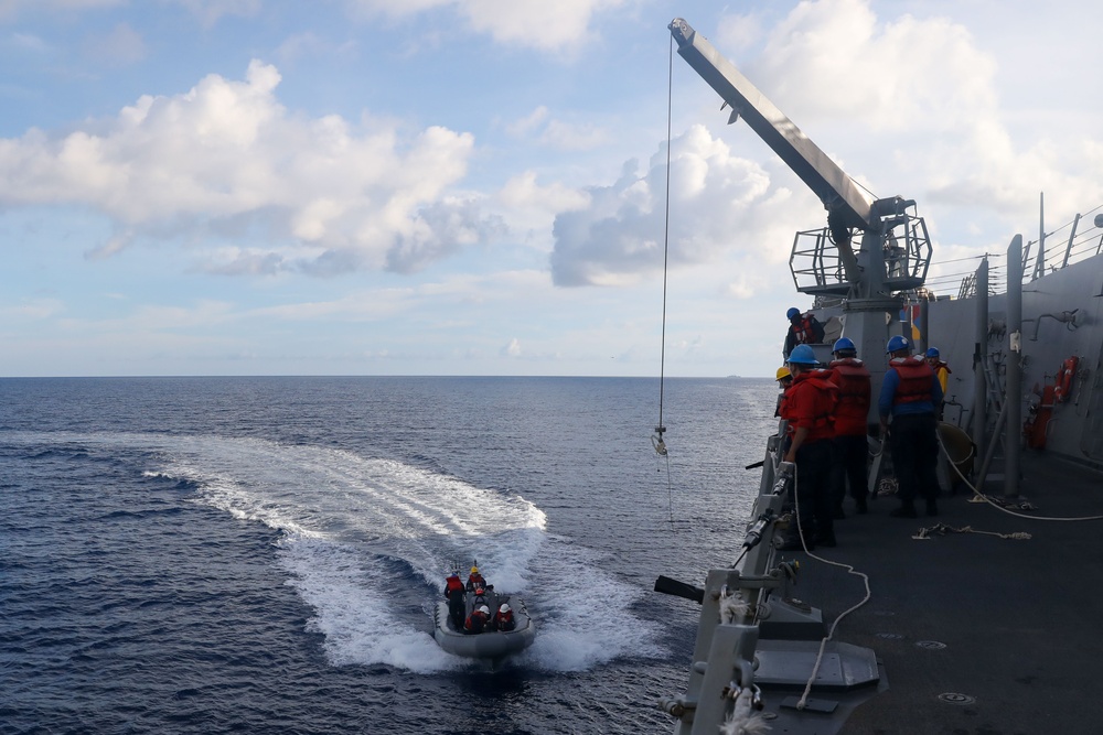 Sailors aboard the USS John Finn conduct a small boat operation during Maritime Cooperative Act in the South China Sea