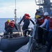 Sailors aboard the USS John Finn conduct a small boat operation during Maritime Cooperative Act in the South China Sea