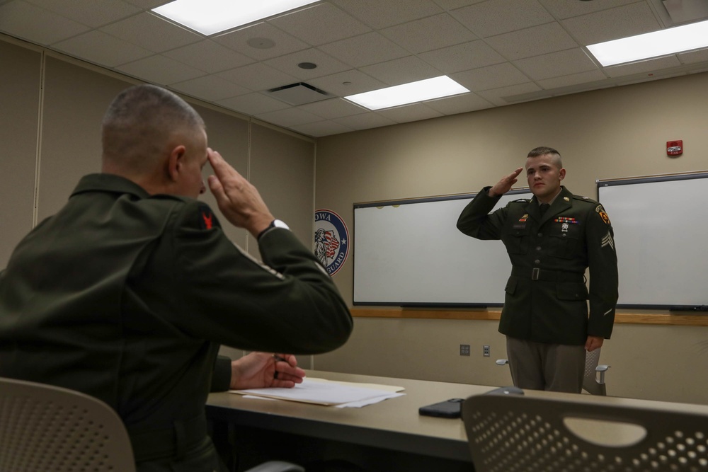 Soldier salutes NCO president of the board
