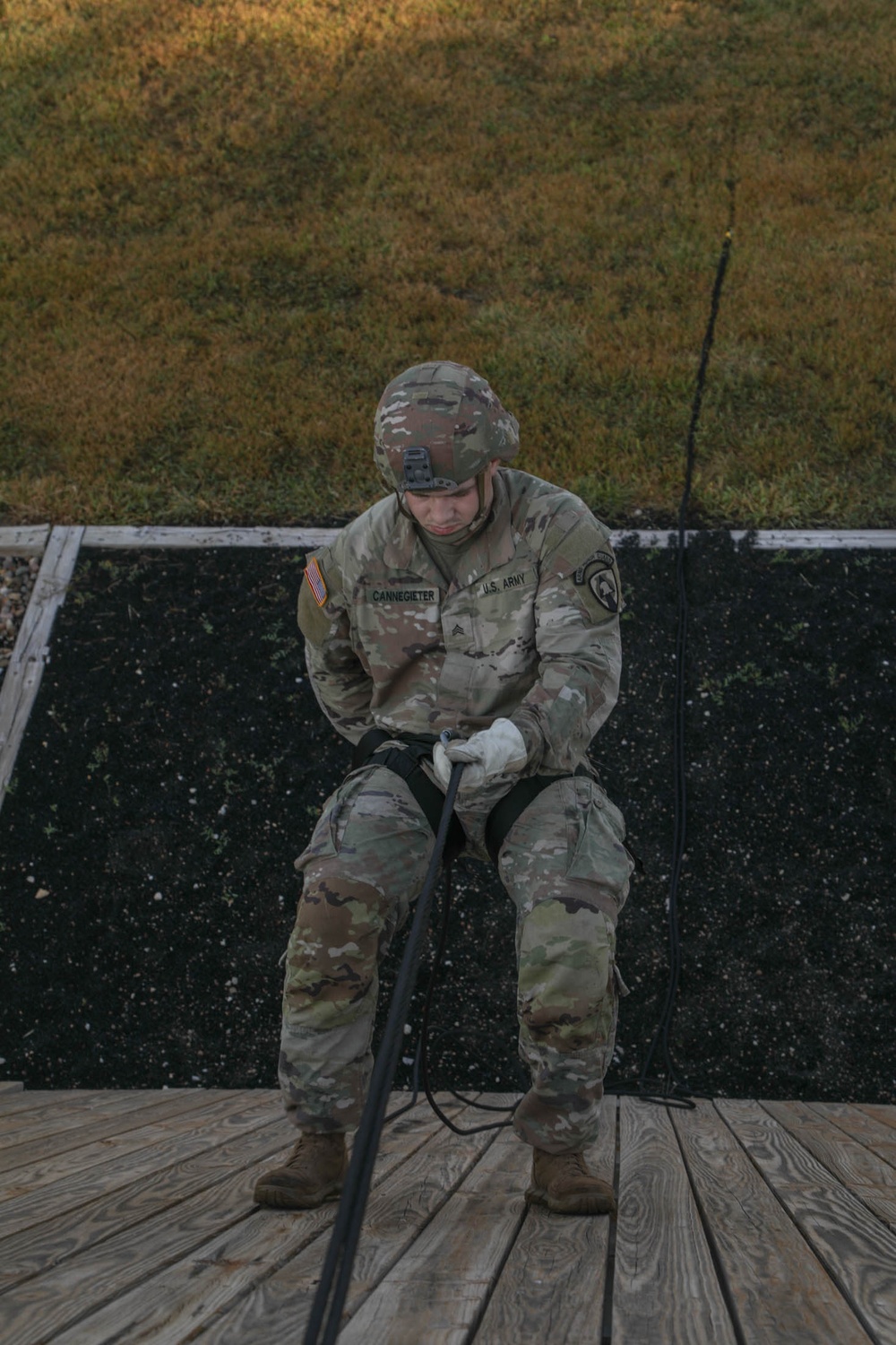 Soldier rappels on slant wall