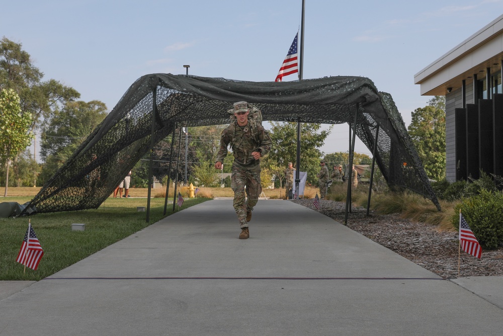 Spc. Tom Hook crosses the finish line